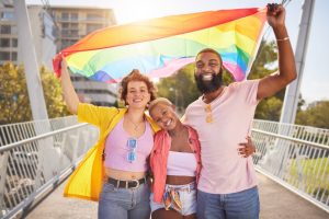 Two gay women (Girlfags) together with their gay partner.